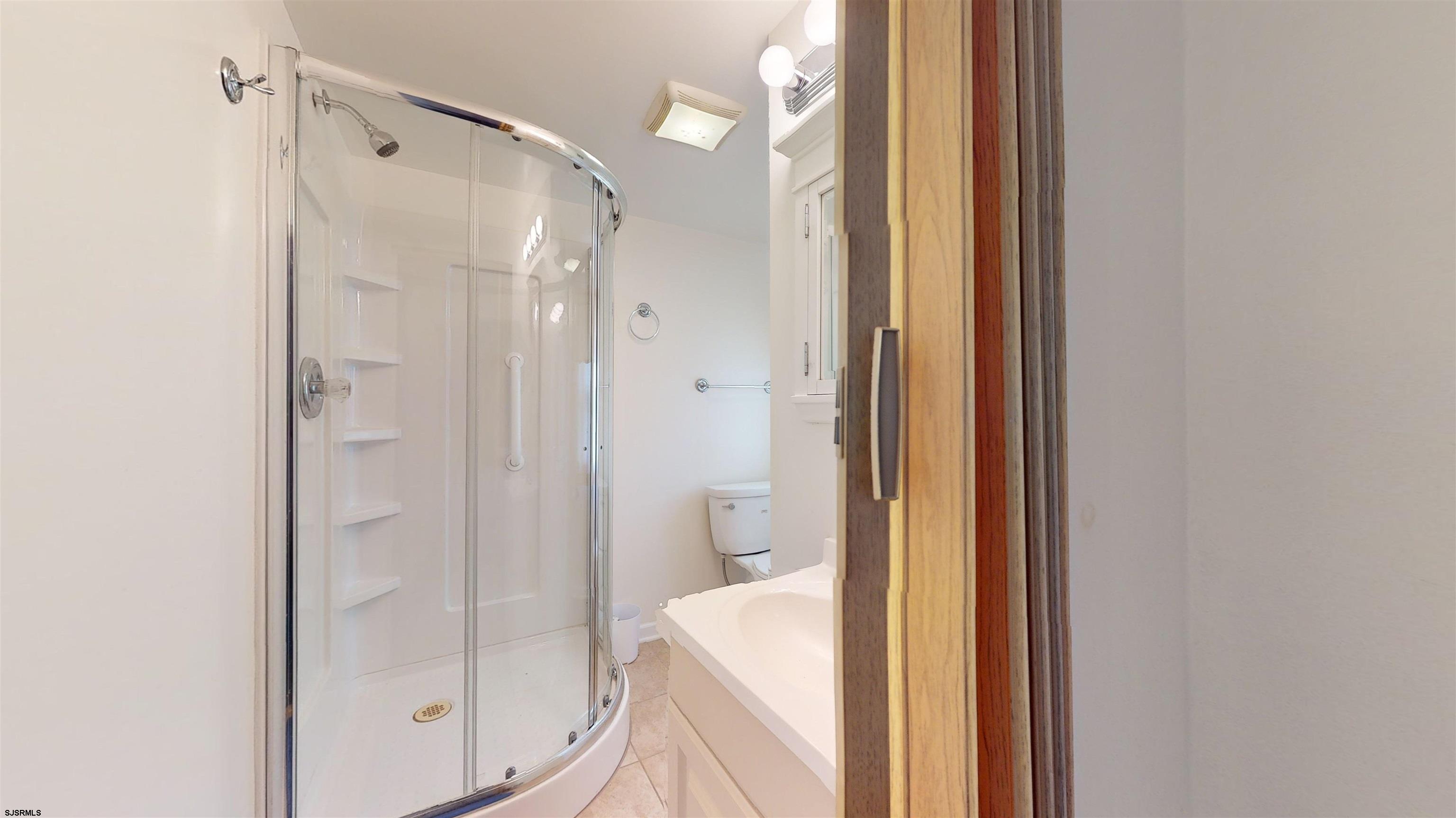 424 Pratt Street Hammonton, NJ 08037 - Photo 35 of 41 a bathroom with a shower and a toilet