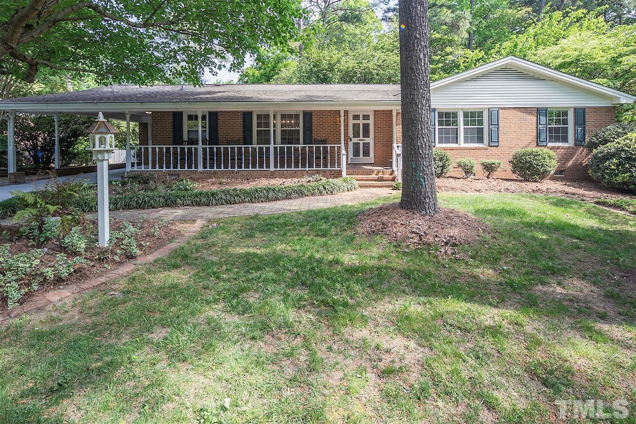 6420 Brandywine Road Raleigh, NC 27607 - Photo 1 of 28 a front view of a house with garden