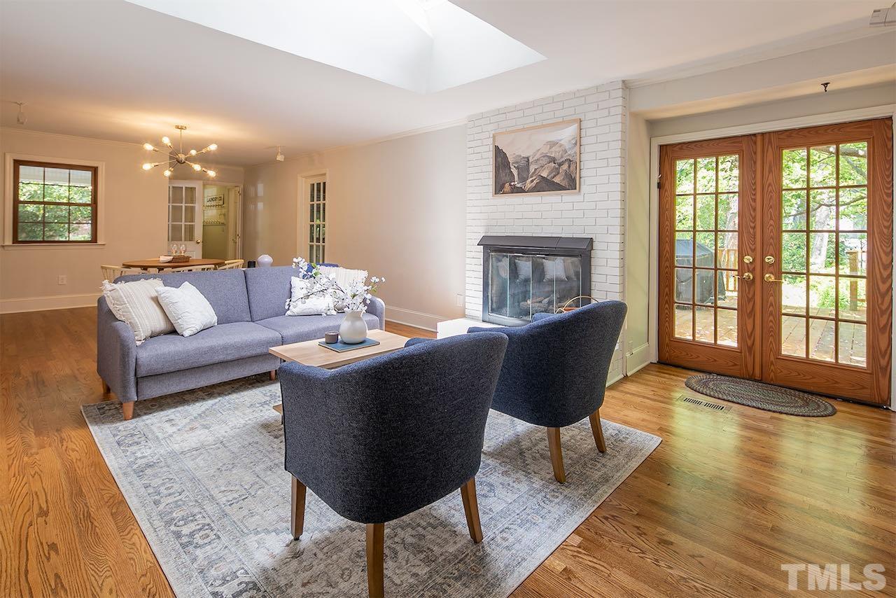 6420 Brandywine Road Raleigh, NC 27607 - Photo 11 of 28 a living room with furniture and a fireplace