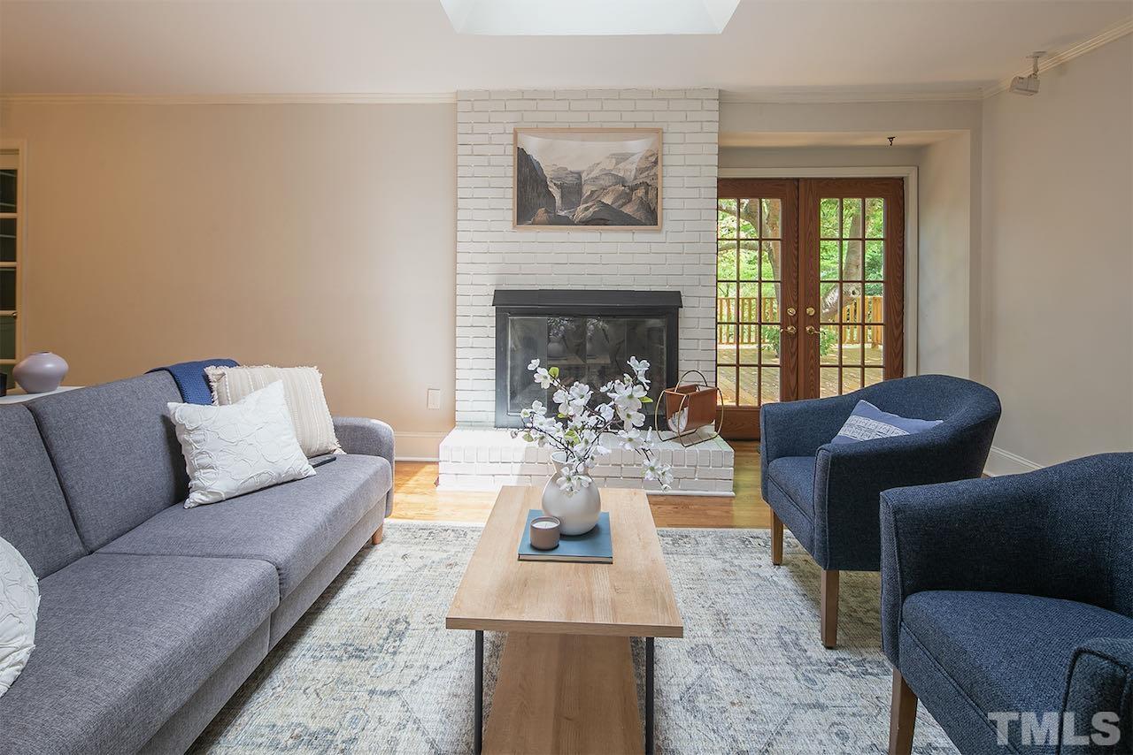 6420 Brandywine Road Raleigh, NC 27607 - Photo 12 of 28 a living room with furniture and a fireplace