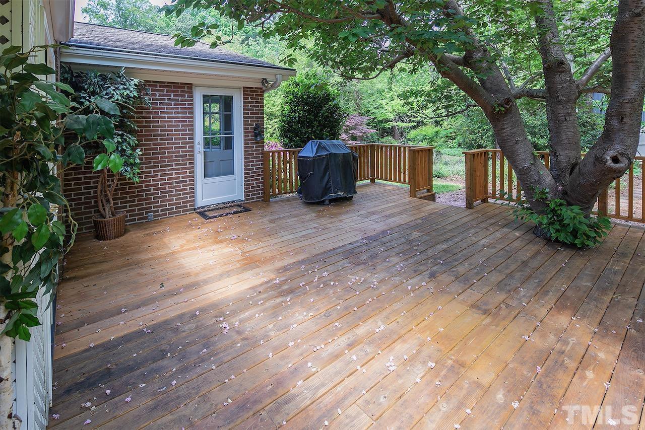 6420 Brandywine Road Raleigh, NC 27607 - Photo 23 of 28 a view of a house with a yard and a large tree