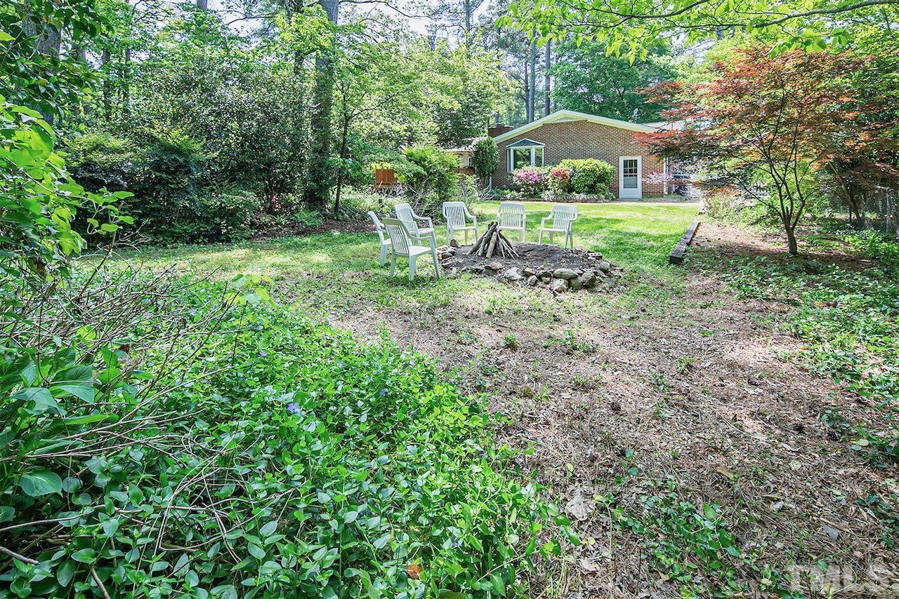 6420 Brandywine Road Raleigh, NC 27607 - Photo 26 of 28 a view of a house with a yard and trees