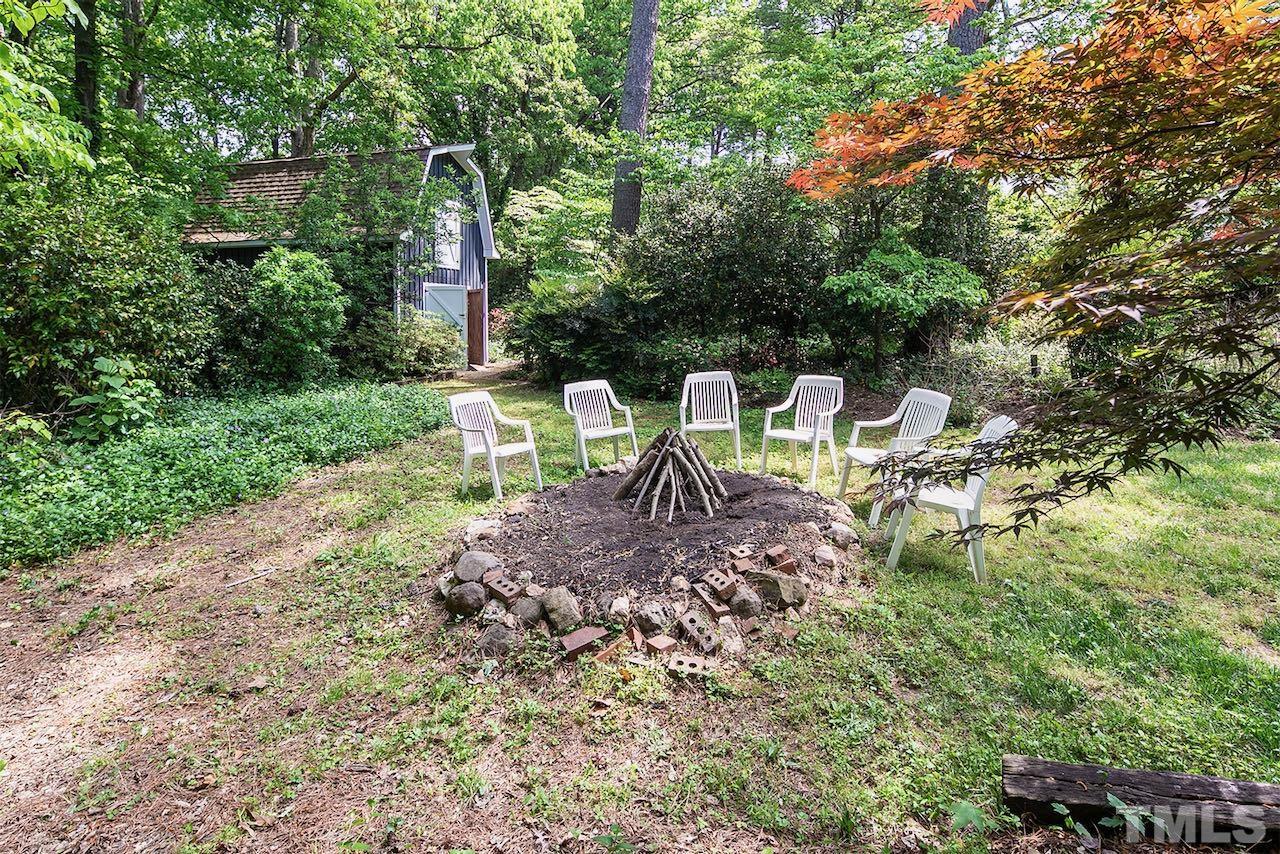 6420 Brandywine Road Raleigh, NC 27607 - Photo 4 of 28 a view of a table and chairs in the garden
