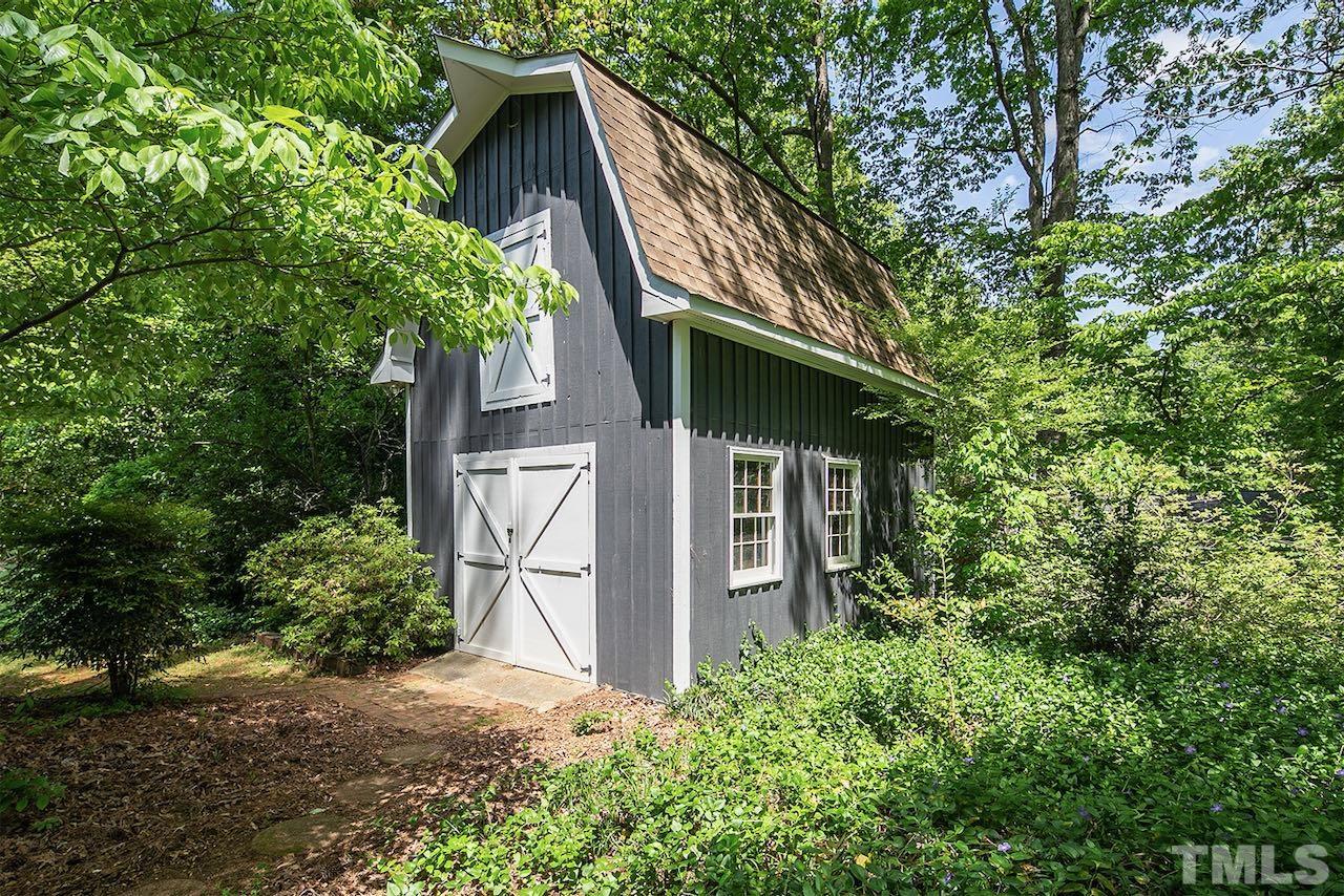 6420 Brandywine Road Raleigh, NC 27607 - Photo 5 of 28 a backyard of a house with lots of green space