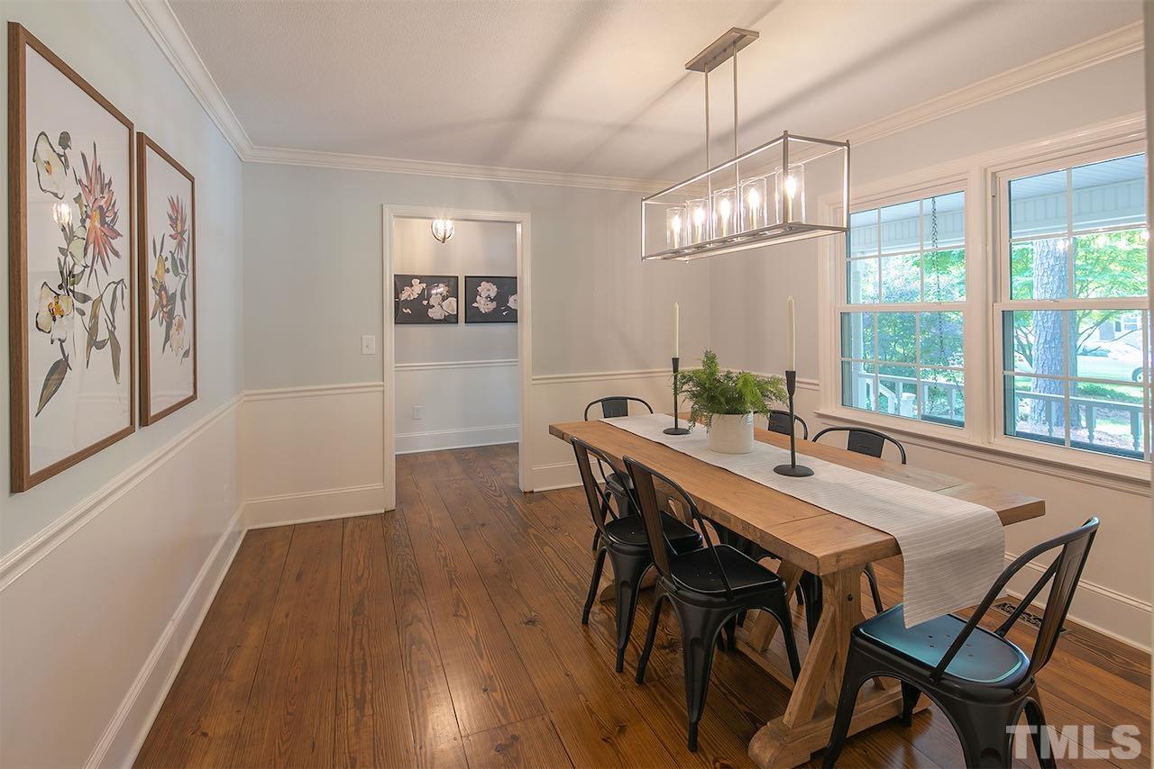 6420 Brandywine Road Raleigh, NC 27607 - Photo 10 of 28 a view of a dining room with furniture window and wooden floor