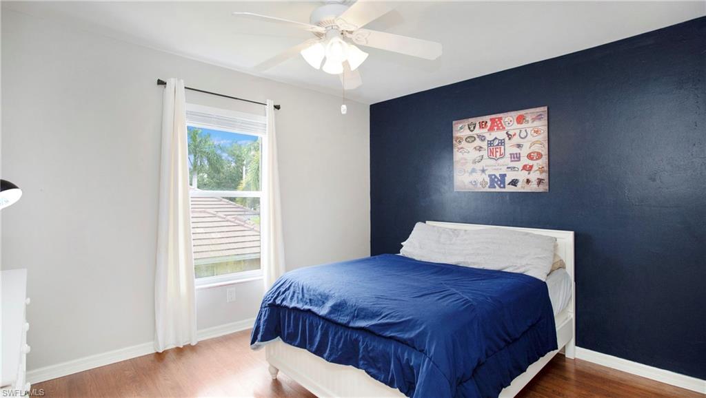 14590 Indigo Lakes Circle Naples, FL 34119 - Photo 27 of 45 Tiled living room with a wealth of natural light