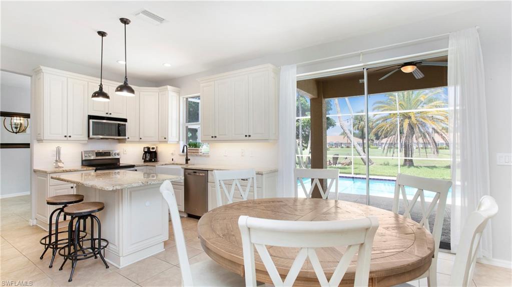 14590 Indigo Lakes Circle Naples, FL 34119 - Photo 10 of 45 Eat-in area flows nicely from the kitchen to the family room area