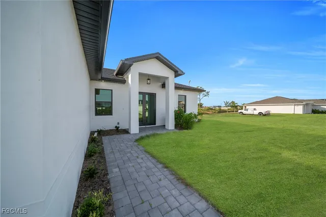 a front view of a house with garden