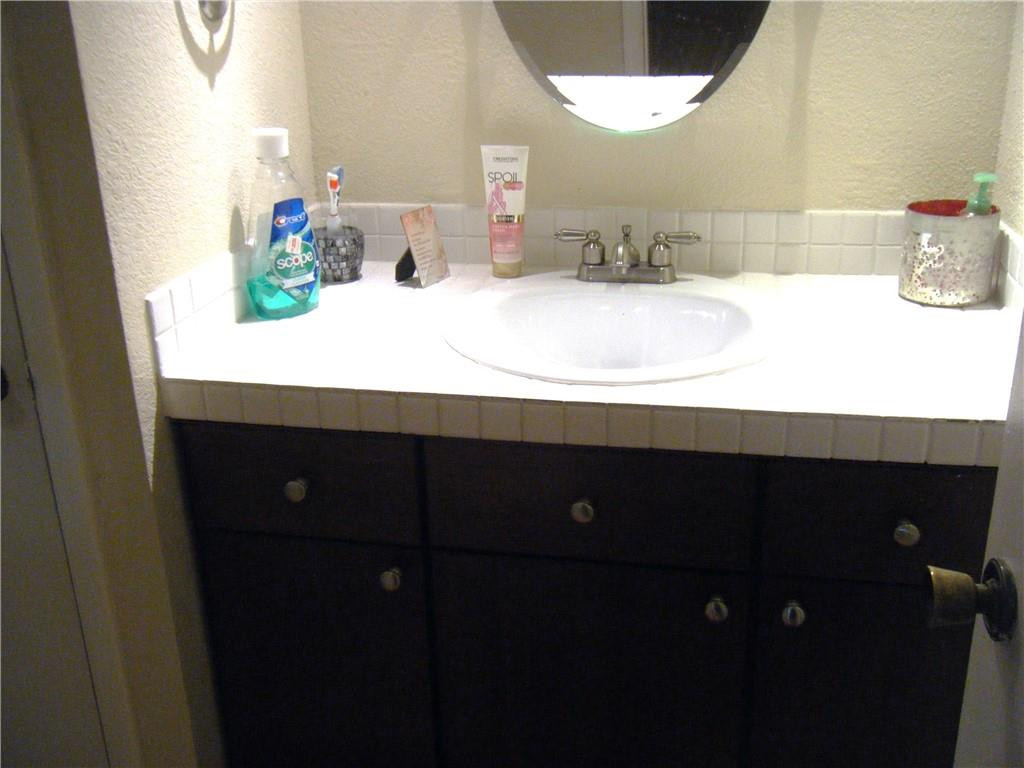 4421 West McNab Road, Unit 19 Pompano Beach, FL 33069 - Photo 12 of 20 a bathroom with a sink and a mirror