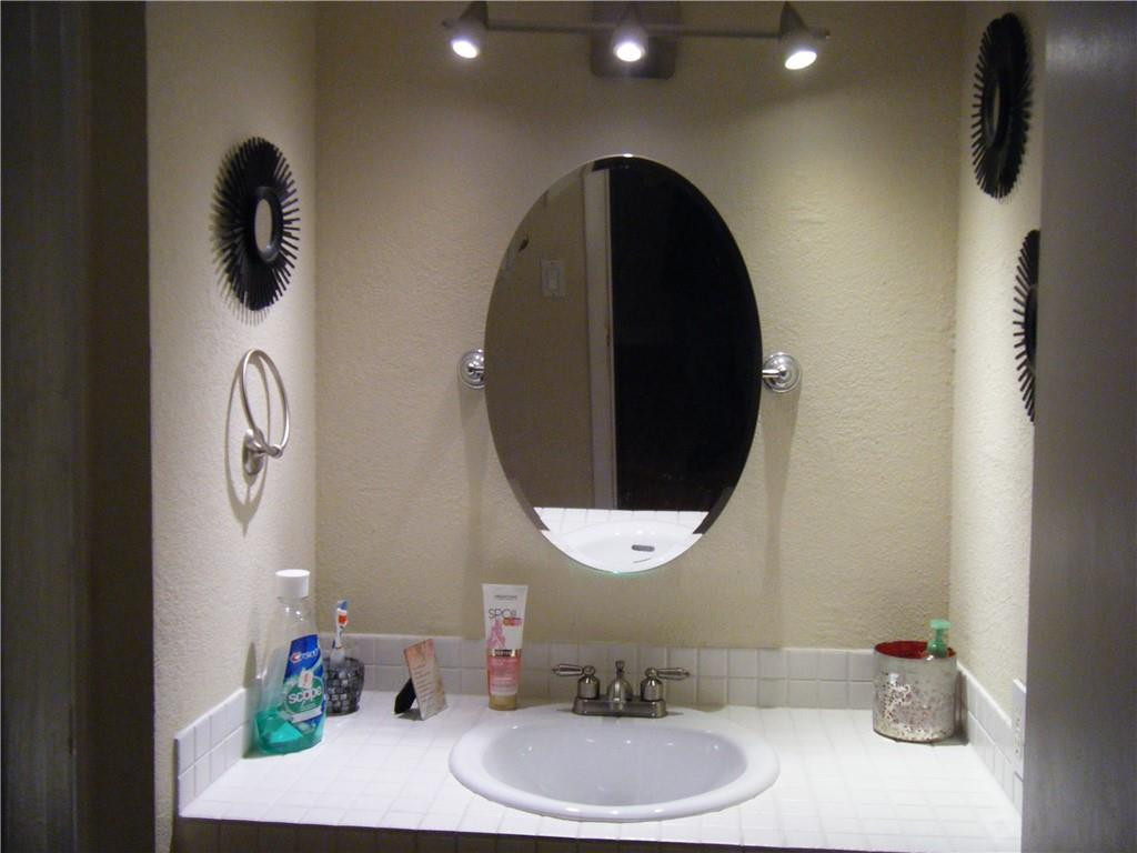 4421 West McNab Road, Unit 19 Pompano Beach, FL 33069 - Photo 13 of 20 a bathroom with a sink and mirror