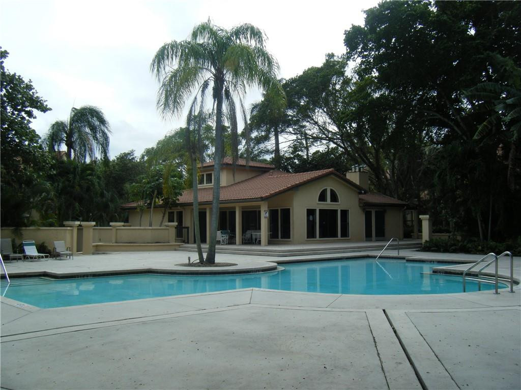 4421 West McNab Road, Unit 19 Pompano Beach, FL 33069 - Photo 20 of 20 a front view of house with yard and green space