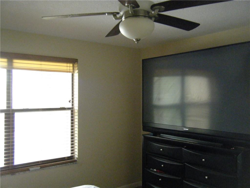 4421 West McNab Road, Unit 19 Pompano Beach, FL 33069 - Photo 9 of 20 a bathroom with a window and a shower