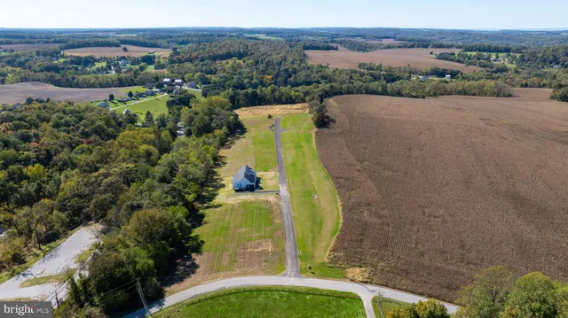 an aerial view of a house with a garden