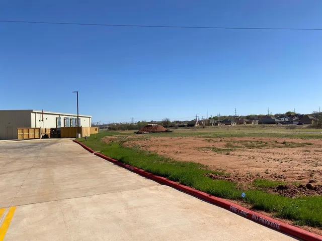 a view of a lake with a big yard