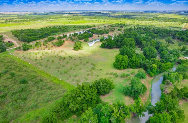 a view of a lake with a yard