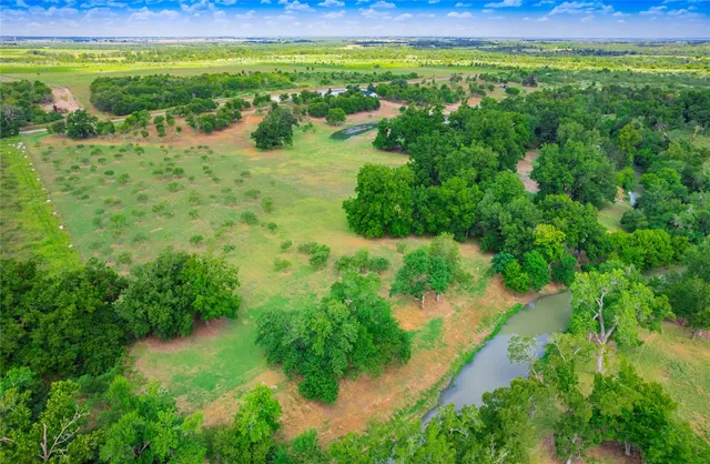 a view of a lake with a big yard