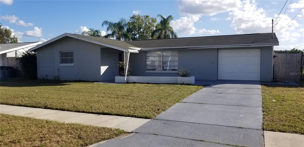 5136 Chime Way Holiday, FL 34690 - Photo 1 of 1 a front view of house with yard