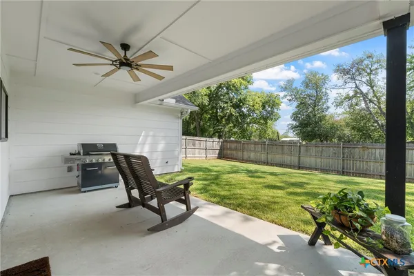 a view of a chairs and tables in the room