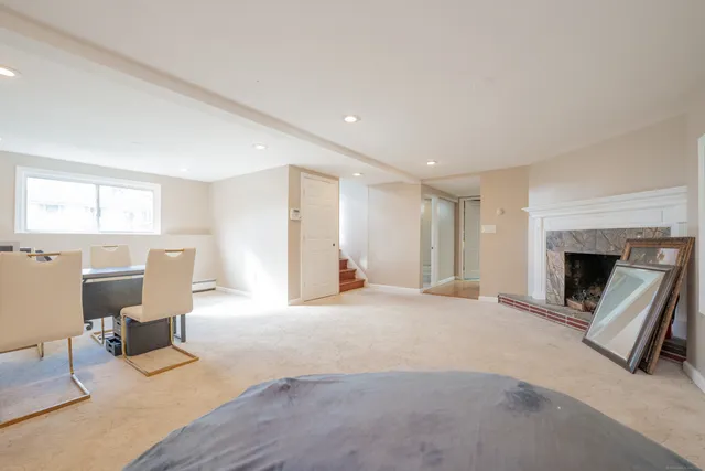 a view of an empty room with a fireplace