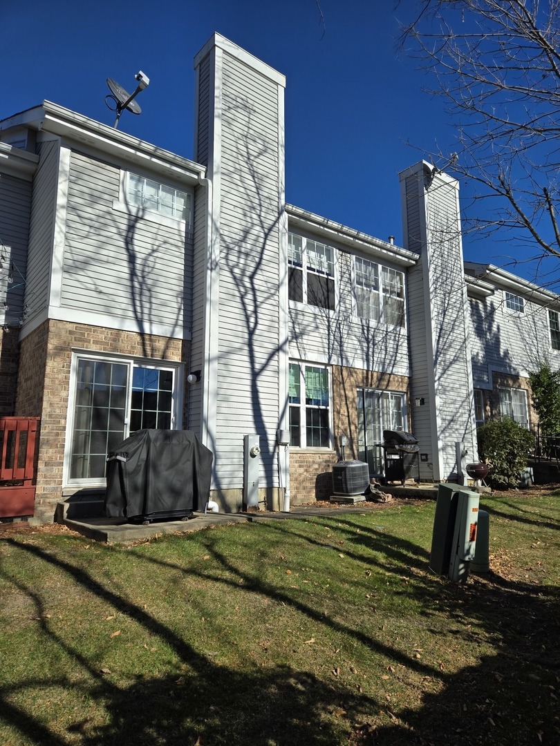 273 West 20th Street Lombard, IL 60148 - Photo 15 of 32 a view of a building with a yard