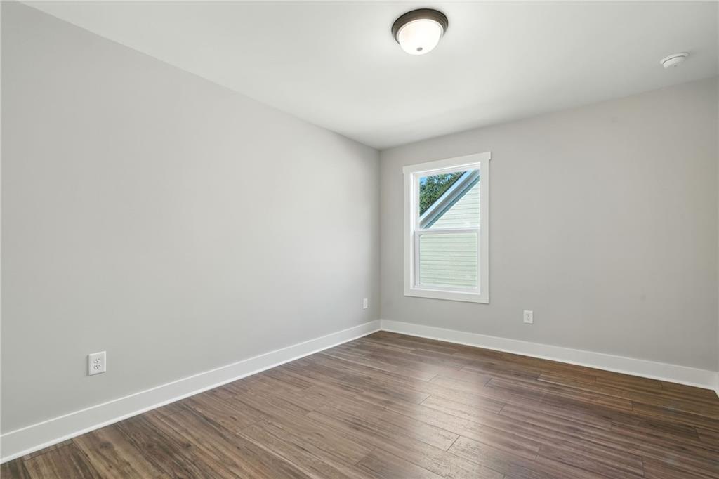125 Old Alabama Road Southeast Emerson, GA 30137 - Photo 30 of 37 an empty room with wooden floor and windows