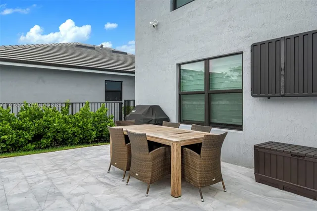 a table and chairs in a patio