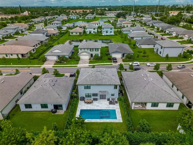 an aerial view of residential houses with outdoor space