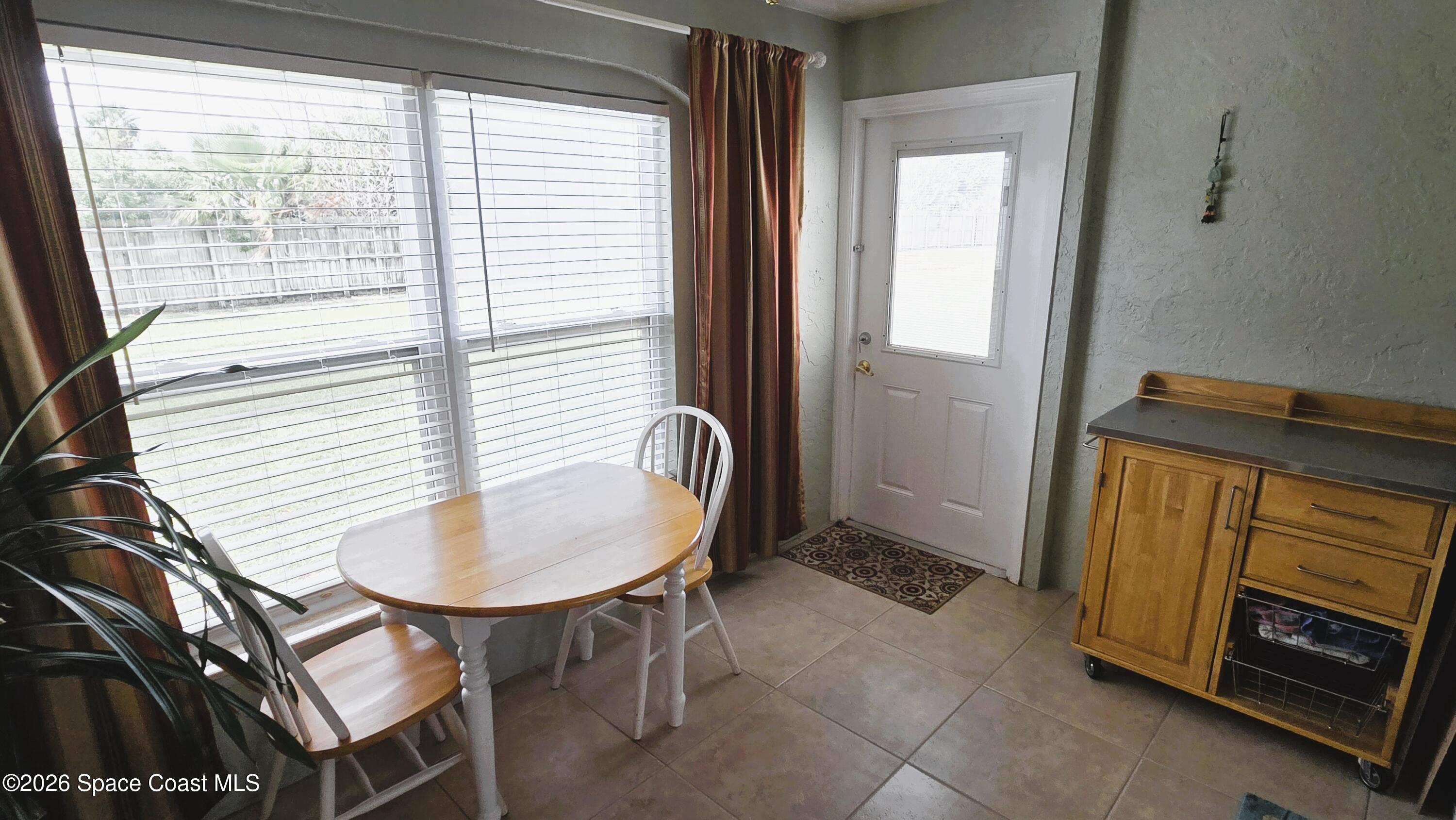 412 School Road, Unit 88 Indian Harbour Beach, FL 32937 - Photo 19 of 50 Enclosed porch w/ rear door