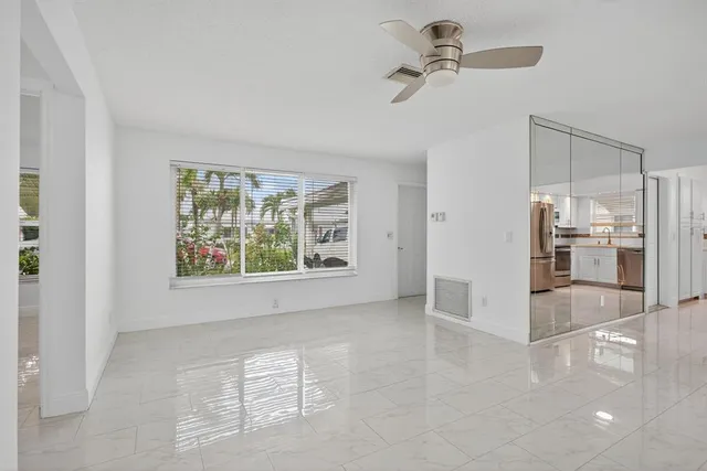 a kitchen with a sink refrigerator and microwave