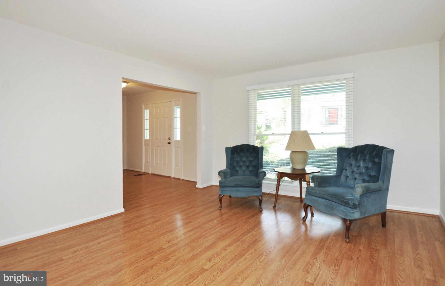 10413 Mountain Quail Road Silver Spring, MD 20901 - Photo 9 of 17 Large bright living room with wood grain Pergo.