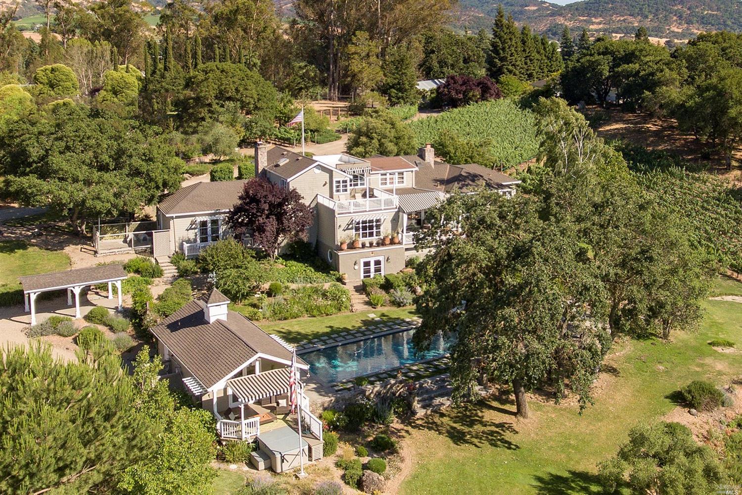 an aerial view of multiple houses with yard