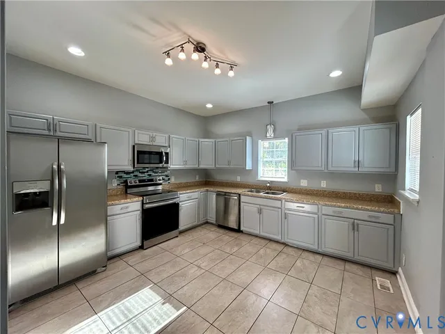 a large kitchen with cabinets