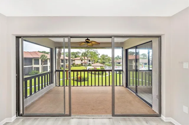 a view of a porch with a floor to ceiling window