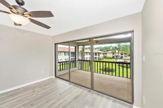 a view of a balcony with wooden floor