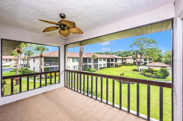 a view of a two chairs in the balcony