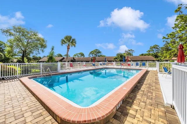 a view of swimming pool with outdoor seating