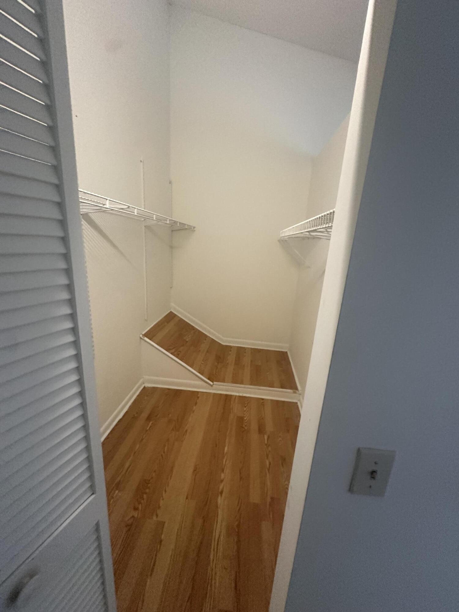 65 Maplecrest Circle Jupiter, FL 33458 - Photo 30 of 31 a view of walk in closet