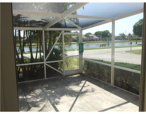 65 Maplecrest Circle Jupiter, FL 33458 - Photo 3 of 31 a house view with a outdoor space