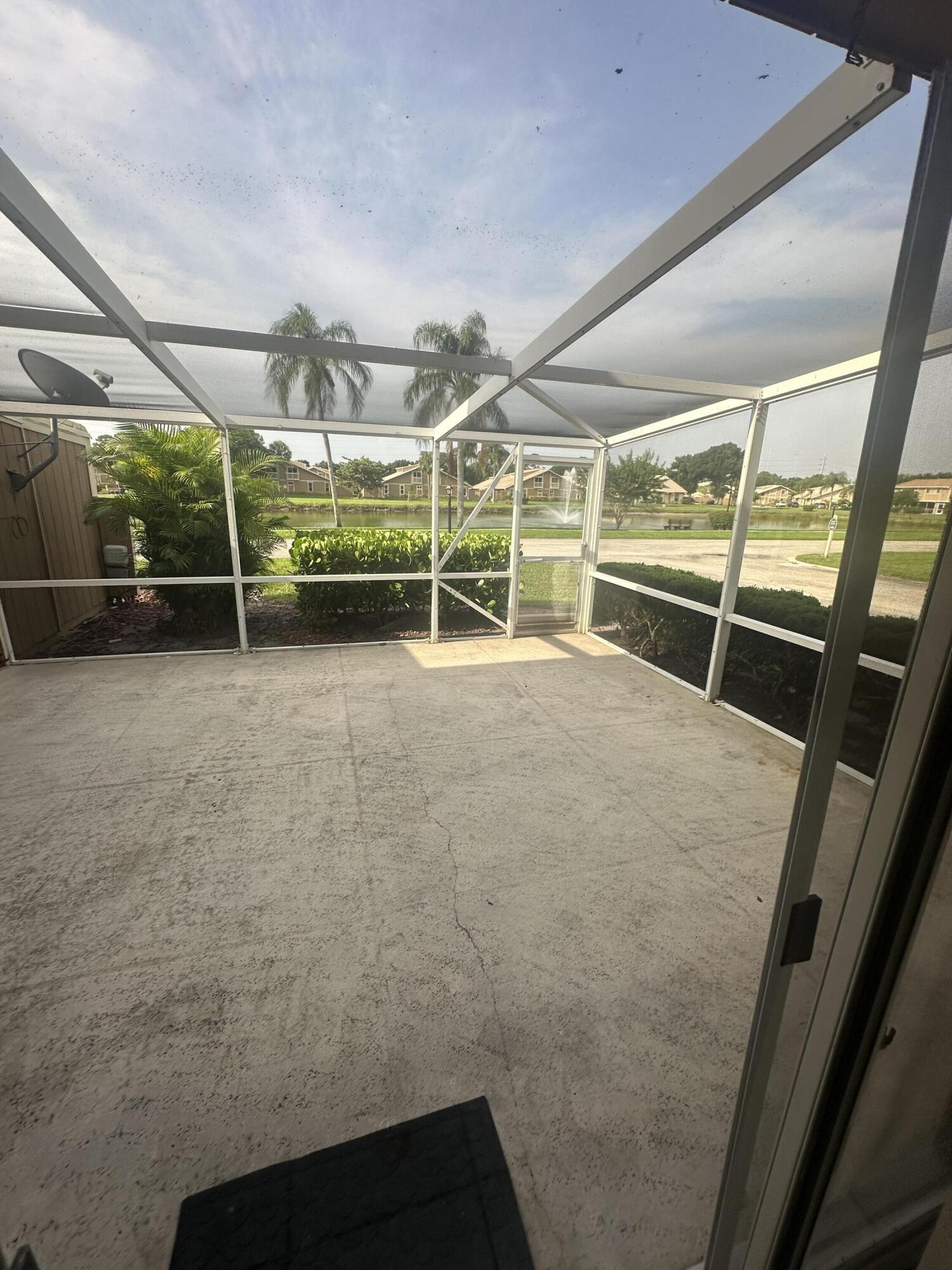 65 Maplecrest Circle Jupiter, FL 33458 - Photo 31 of 31 a view of an empty room with wooden floor