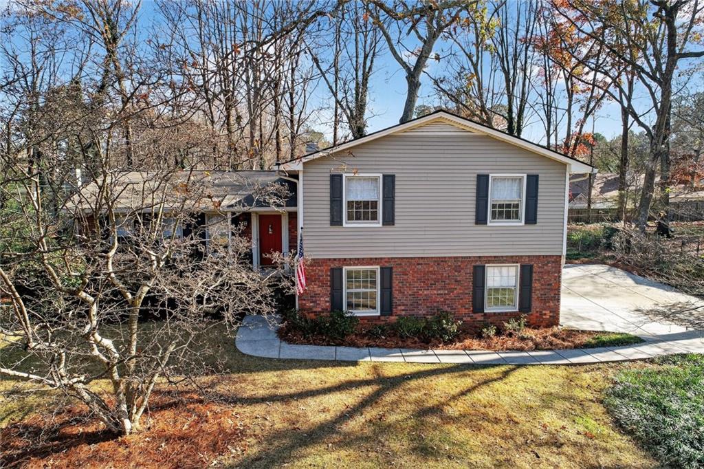 2902 Timberline Road Marietta, GA 30062 - Photo 1 of 1 a front view of a house with yard and green space