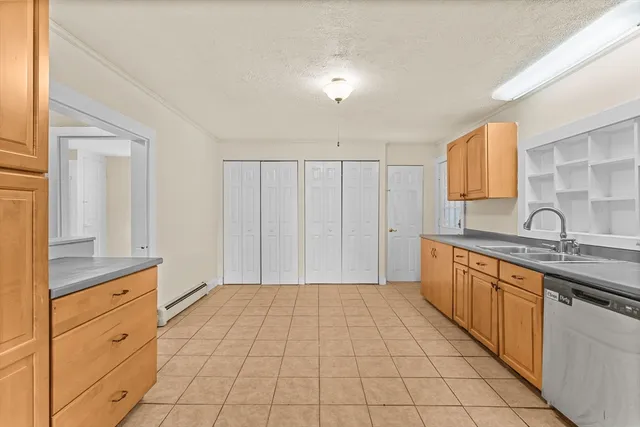 a spacious bathroom with a sink and a mirror