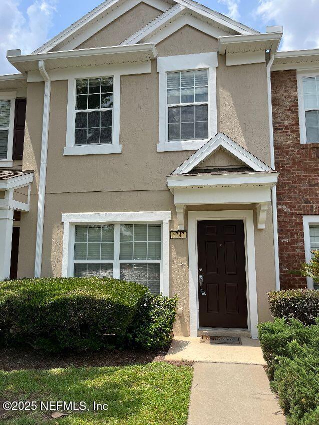6747 Arching Branch Circle Jacksonville, FL 32258 - Photo 1 of 25 a front view of a house with a yard