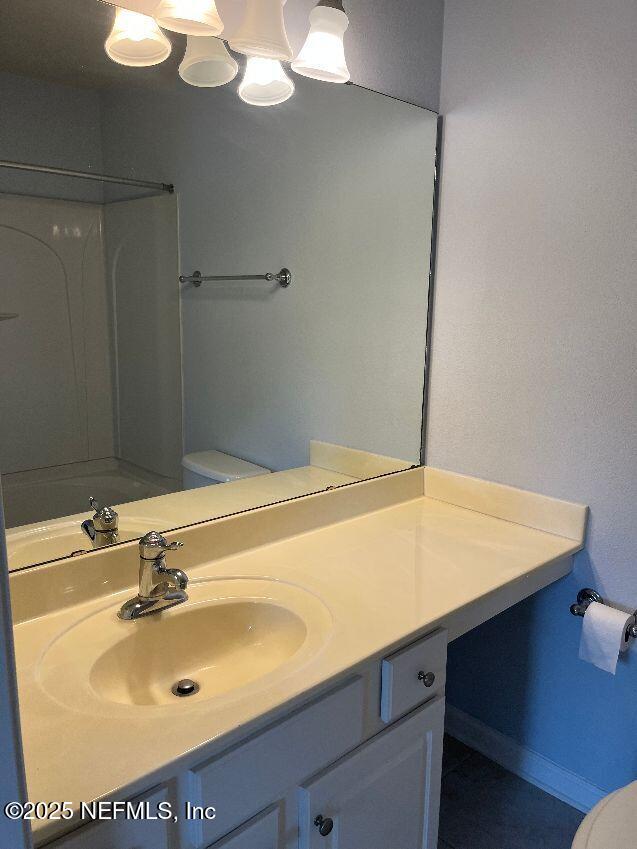 6747 Arching Branch Circle Jacksonville, FL 32258 - Photo 16 of 25 a bathroom with a sink and a mirror
