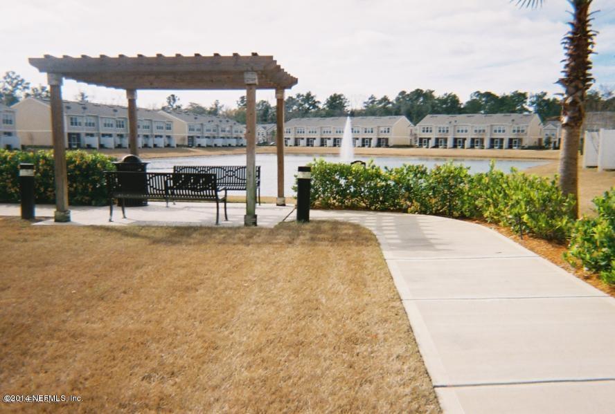 6747 Arching Branch Circle Jacksonville, FL 32258 - Photo 18 of 25 a view of a swimming pool with a patio