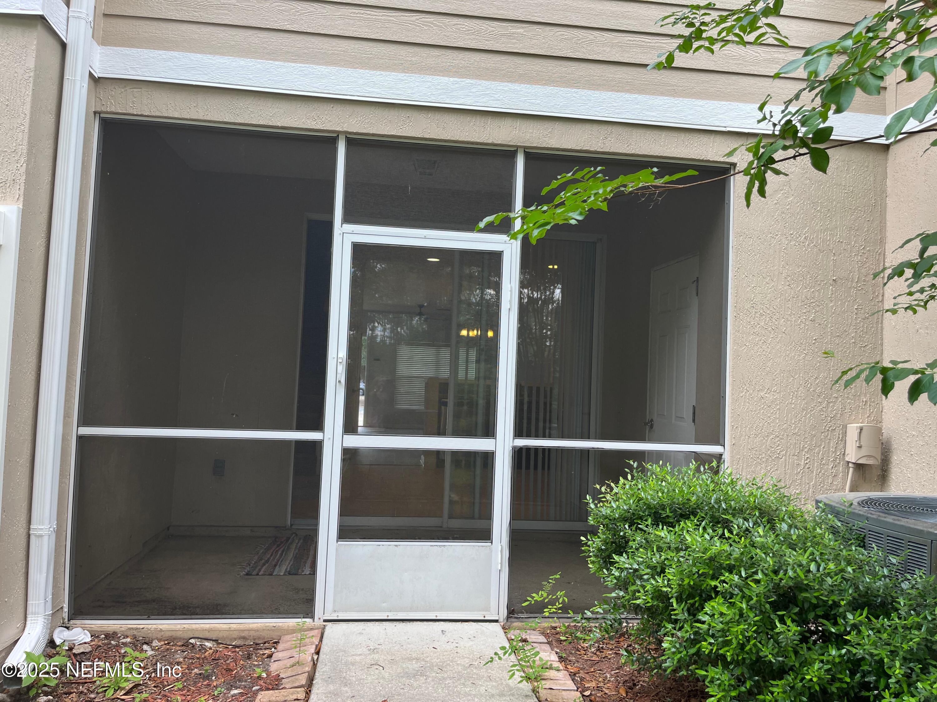 6747 Arching Branch Circle Jacksonville, FL 32258 - Photo 24 of 25 a black and white wall with a large window