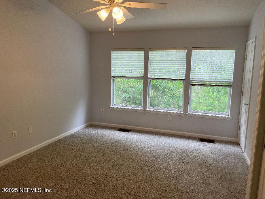 6747 Arching Branch Circle Jacksonville, FL 32258 - Photo 9 of 25 an empty room with a window