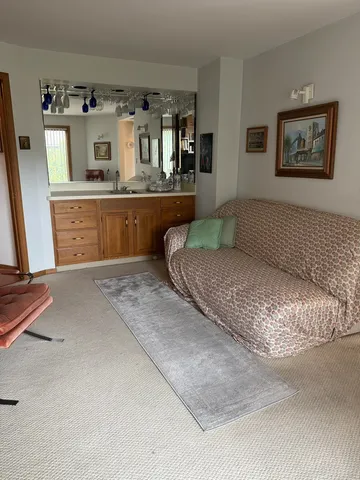 a living room with granite countertop furniture and painting on the wall