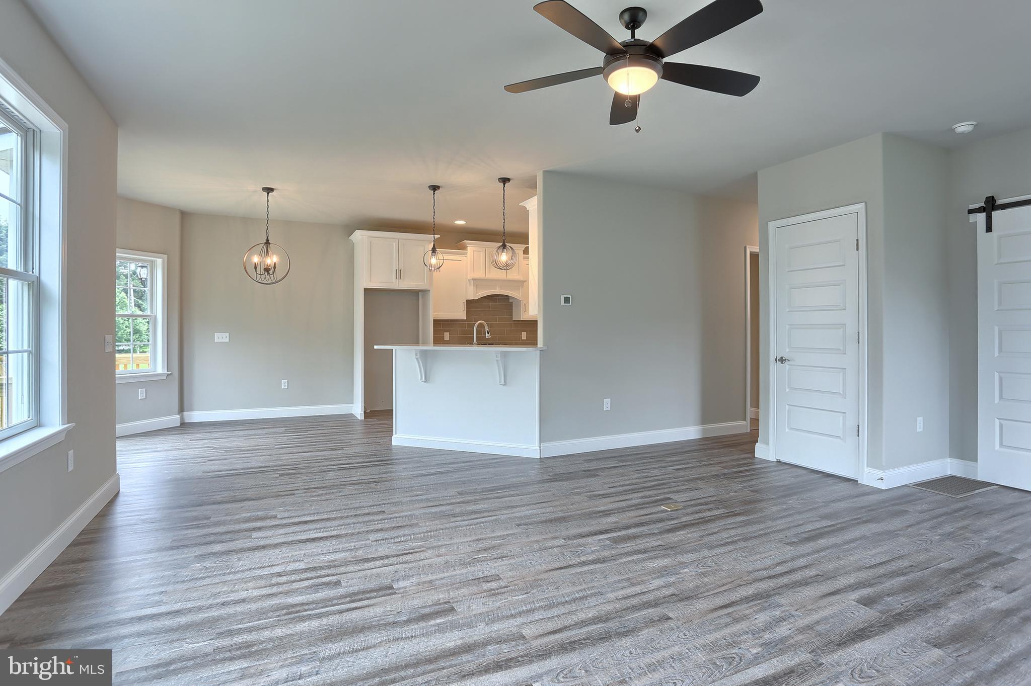 3 Rolling Meadow Road Lebanon, PA 17046 - Photo 11 of 34 a view of empty room with wooden floor and ceiling fan