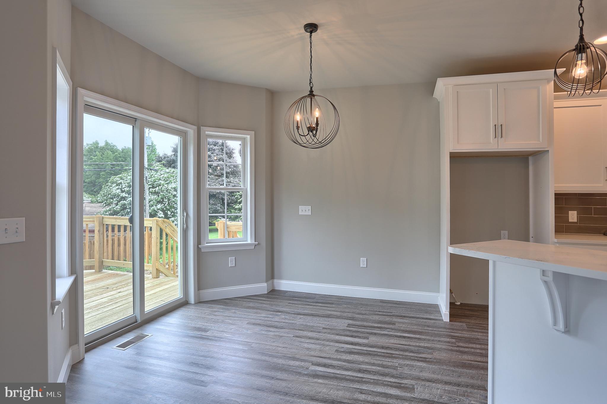 3 Rolling Meadow Road Lebanon, PA 17046 - Photo 13 of 34 a view of an empty room with wooden floor and a window