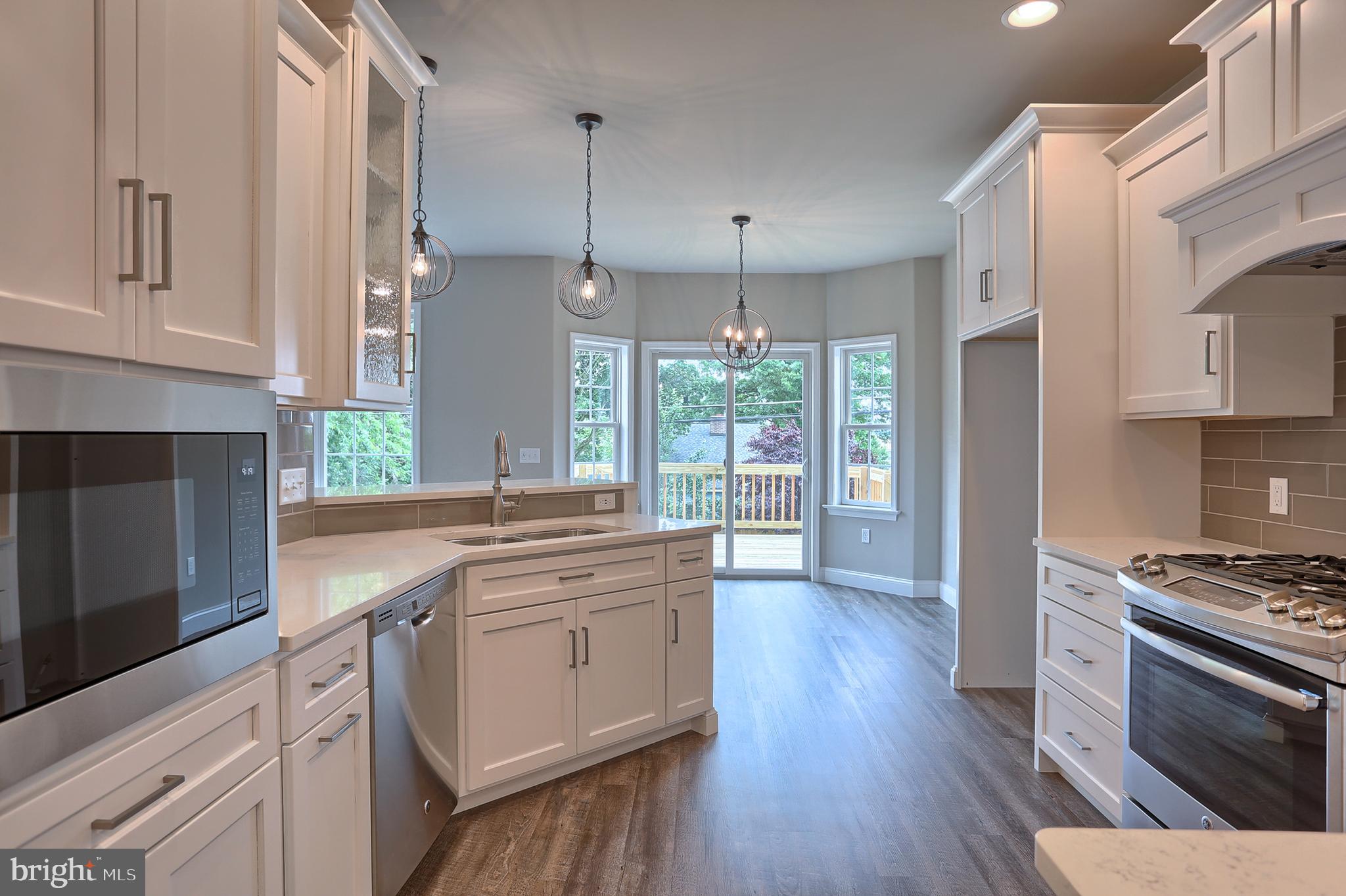 3 Rolling Meadow Road Lebanon, PA 17046 - Photo 15 of 34 a kitchen with stainless steel appliances a stove sink and microwave
